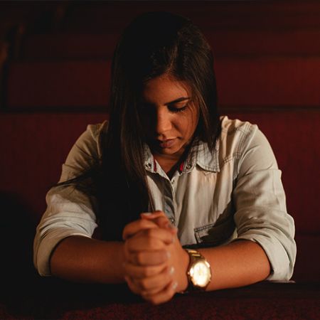 Young woman praying